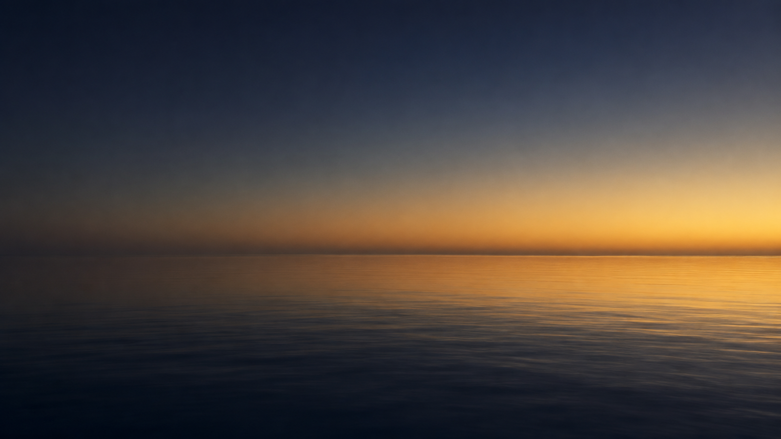 Calm open water at dawn